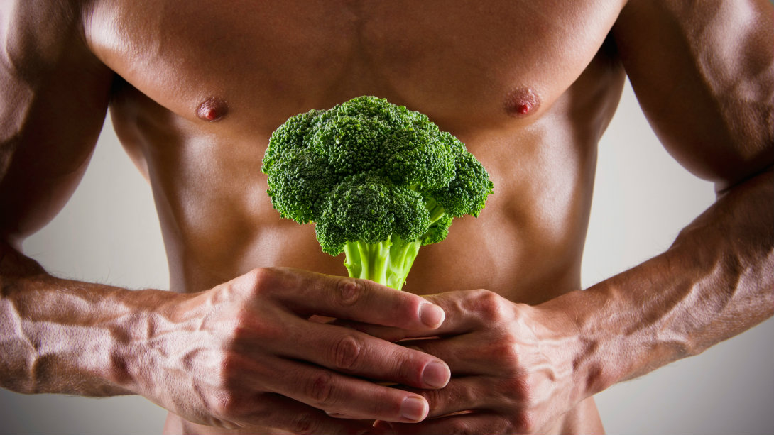 https://www.muscleandfitness.com/wp-content/uploads/2014/12/man-holding-broccoli-stem.jpg?quality=86&strip=all