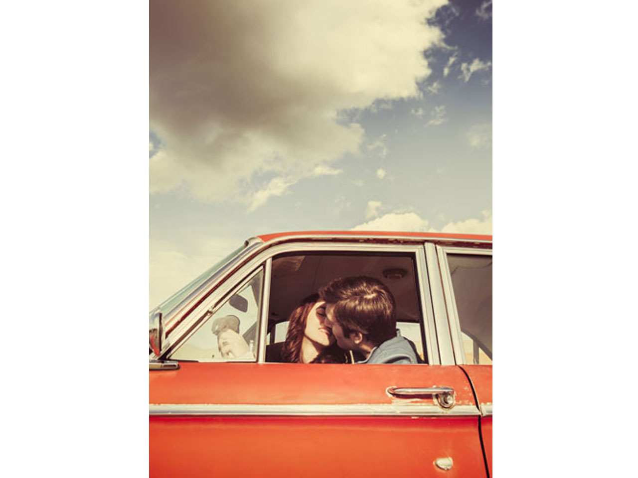 Couple kissing in the car