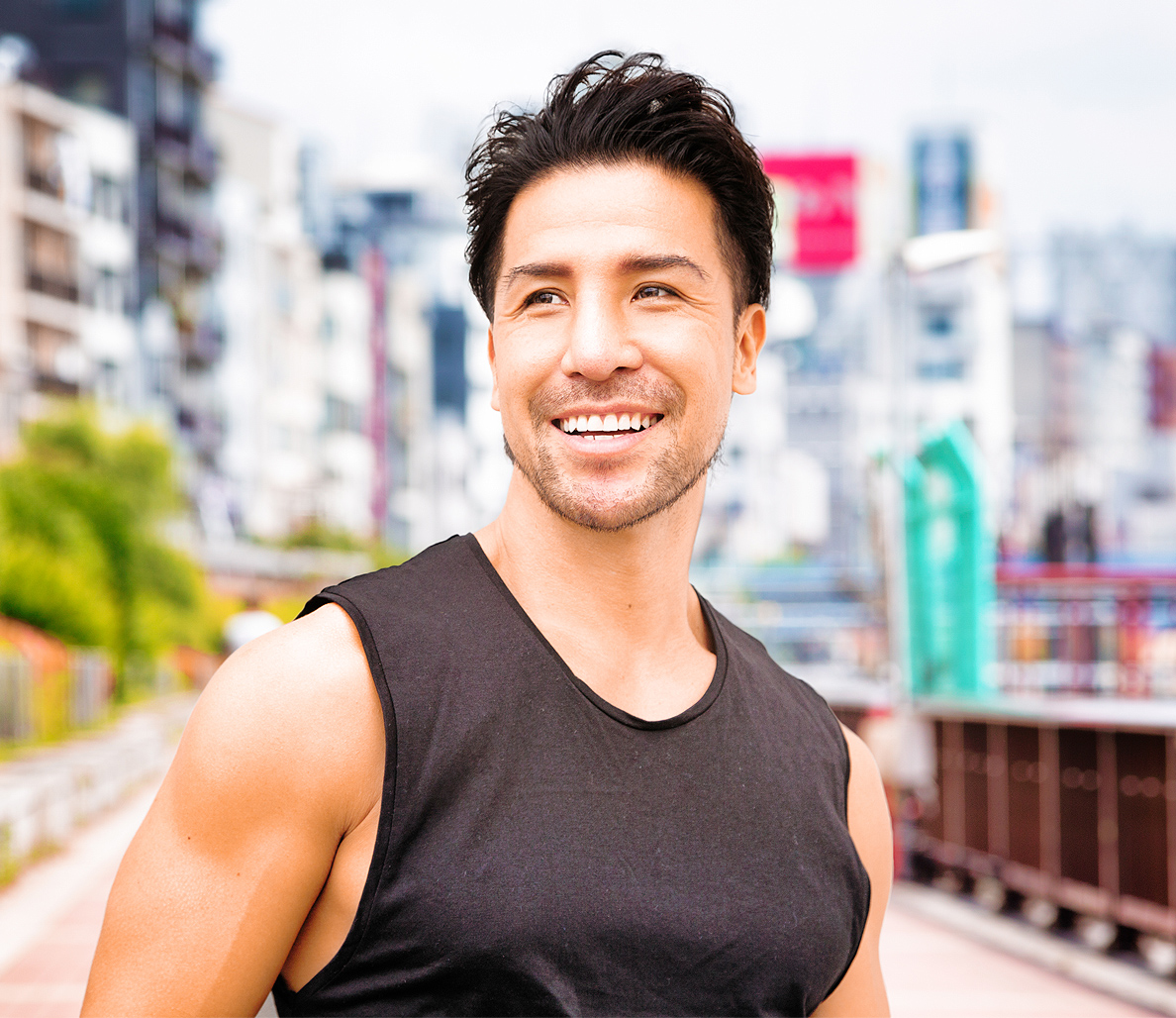 Muscular man in tank smiling