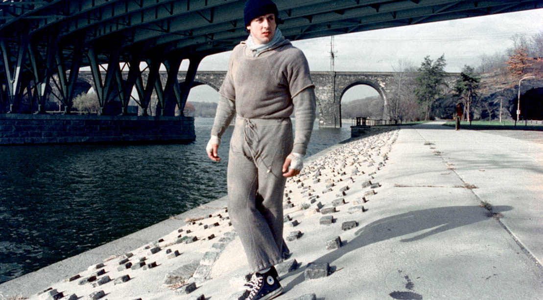 Actor Sylvester Stallone as Rocky Balboa wearing grey sweats