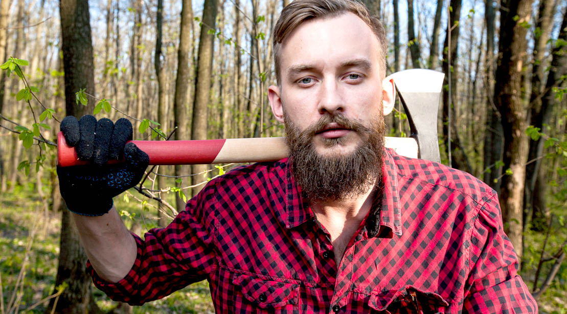 Man with a beard dressed up in a lumber jack halloween costume