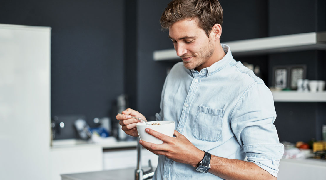 Man Eating a Bowl of Food