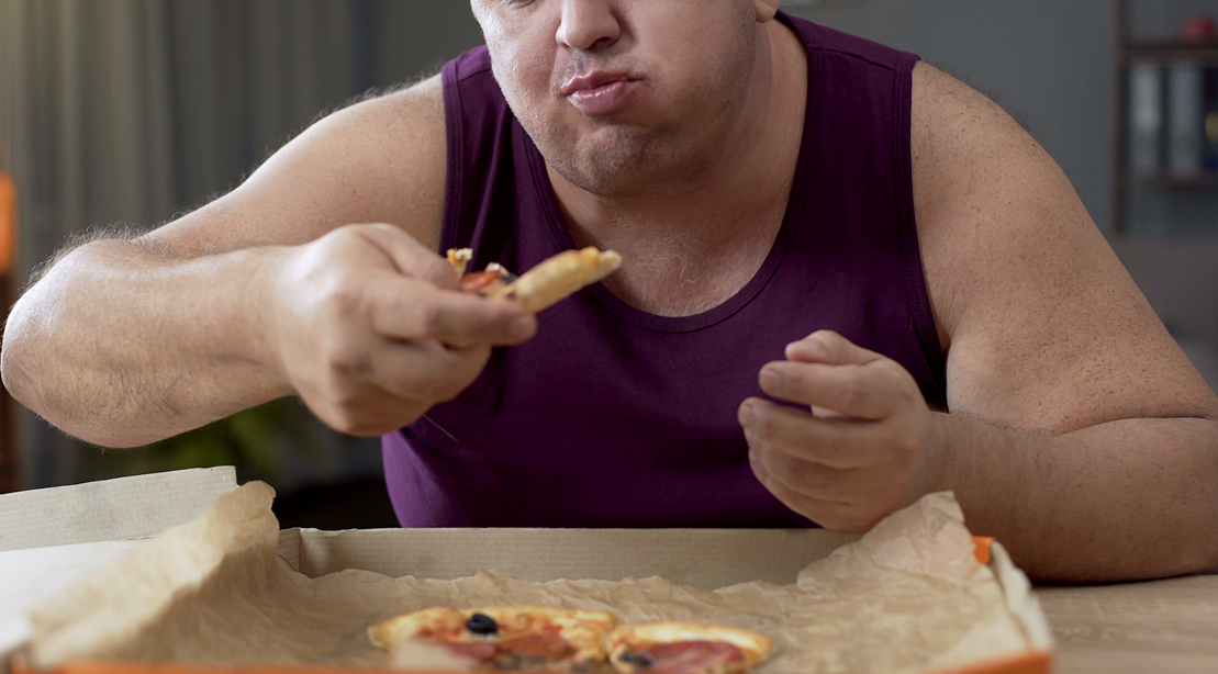 Heavy-Man-Eating-Pizza-From-Box