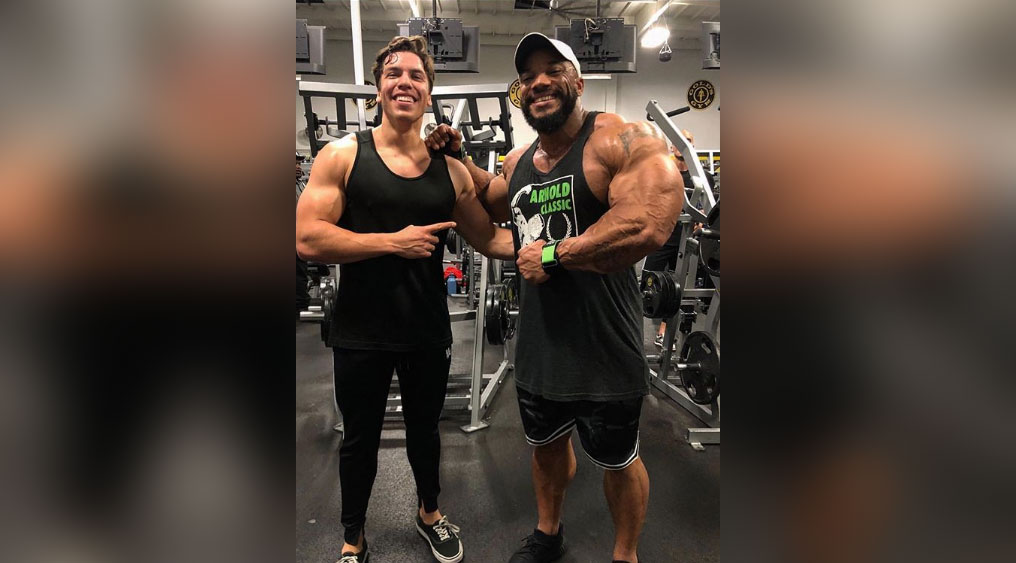 Joseph Baena Poses With Sergio Oliva Jr. Muscle Fitness