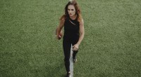 NFL Female Coach Jen Welter walking on the football field