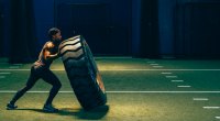 Mountain climber Andrew Alexander King training with tire flip exercise