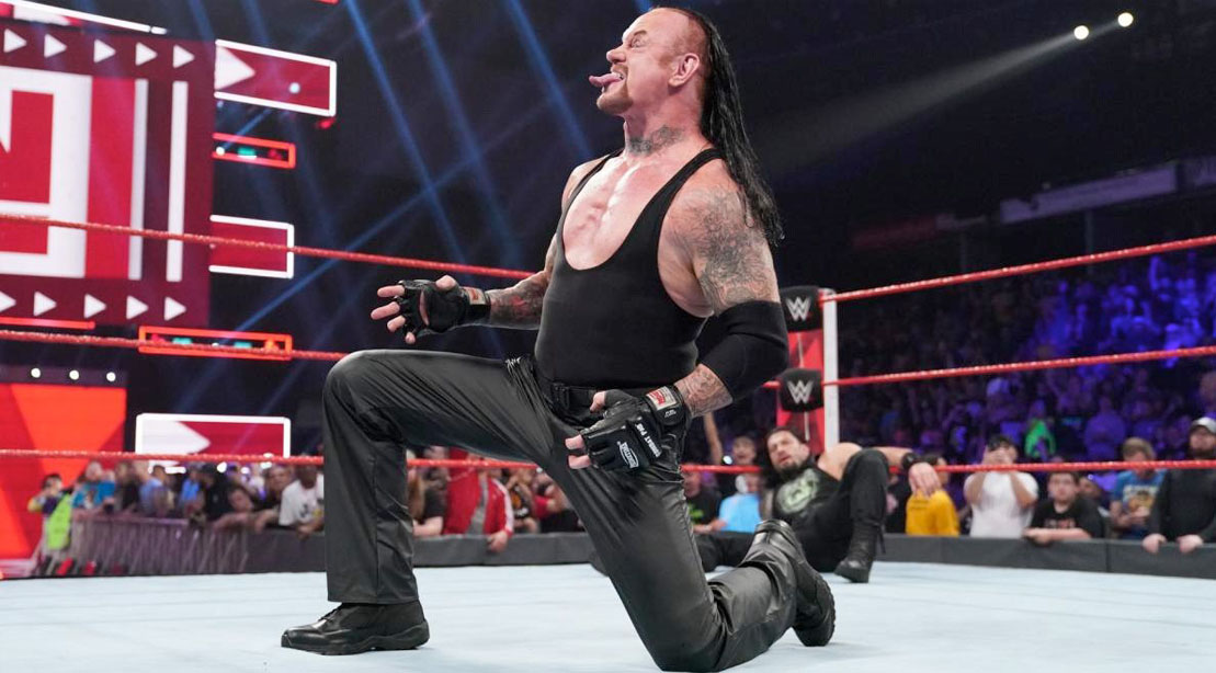 The Undertaker sticking out his tongue before a wrestling match