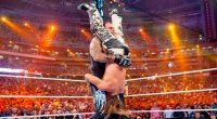 Wrestler Shawn Michaels getting tombstone pile driver by The Undertaker