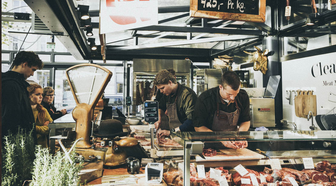 Butchers at a store in a meat market