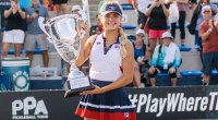 Pickleball champion Anna Leigh Waters holding a pickleball trophy