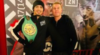 Boxer Diego Pacheco on the red carpet holding a championship belt