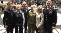 Nick Gist in uniform with his family