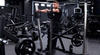 Bodybuilder Ryan Terry performing a standing chest press